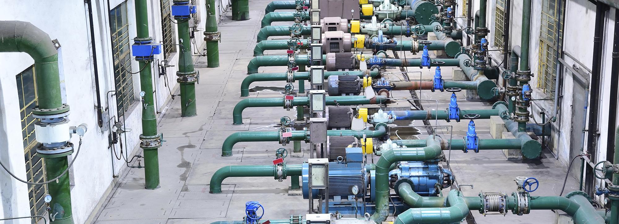 view of blue and green gas pipelines in a factory